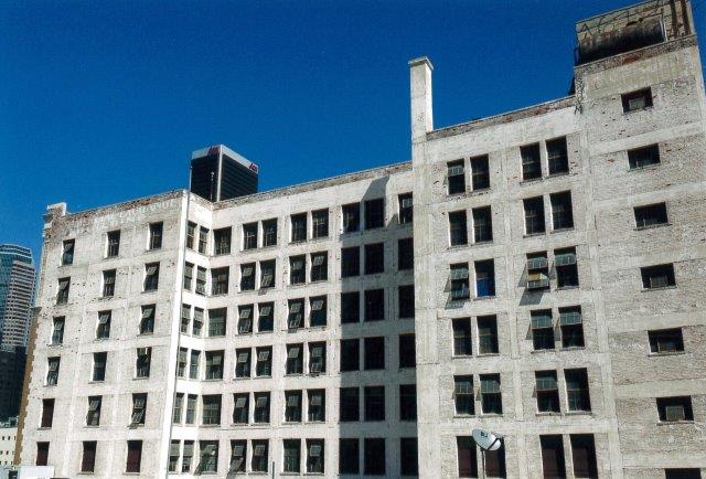 Before: rear of building with weathered paint.